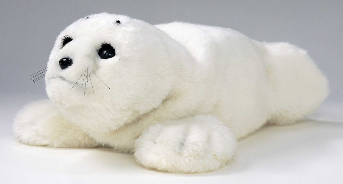 This cute robot seal's name is PARO! It helps to entertain