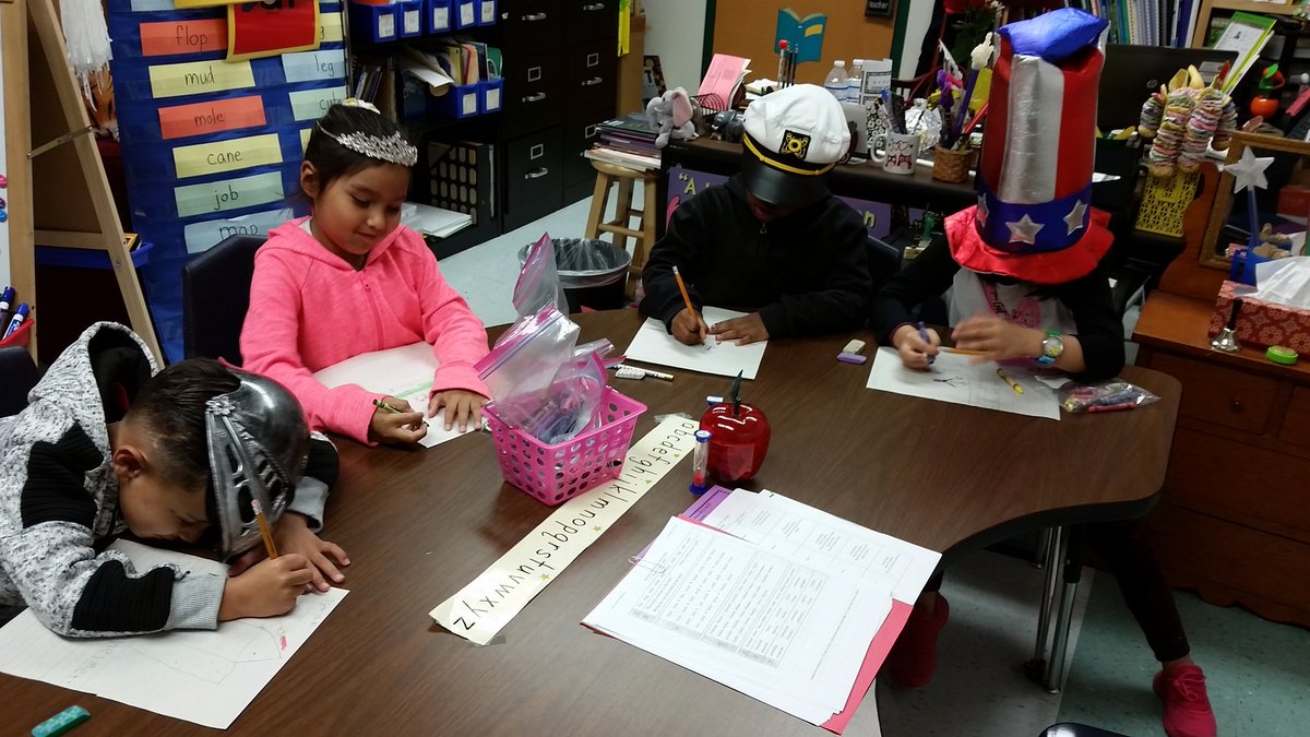 lyssy4literacy's tweet photo. @NISDRhodes 1st graders wearing hats and writing in the style of the author. #readingandwritingfun https://t.co/3PF33qdwC2
