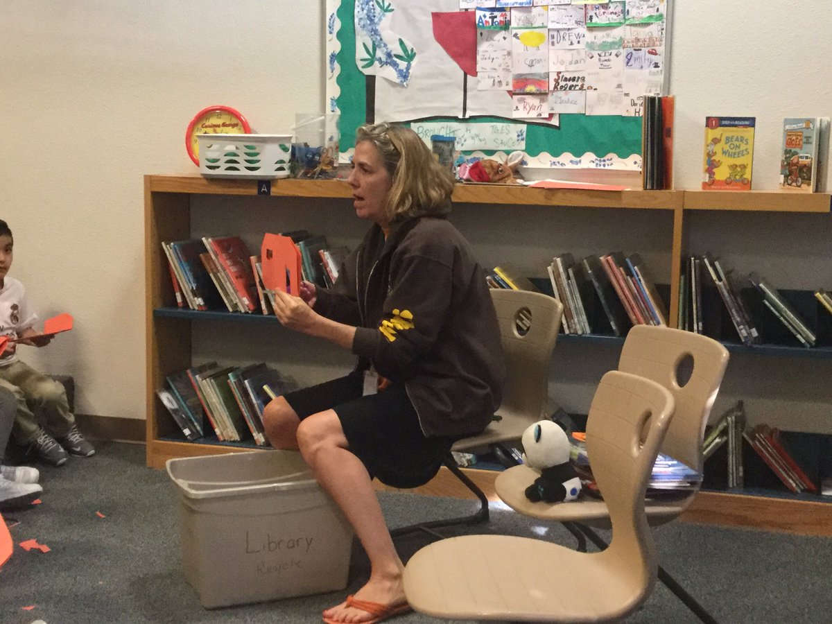 HarrisPhilpott's tweet photo. Making jack-o-lanterns by cutting "doors" for characters during story time in the library. Following directions summarizing. @hornetstrong https://t.co/QFfi1Qmul0