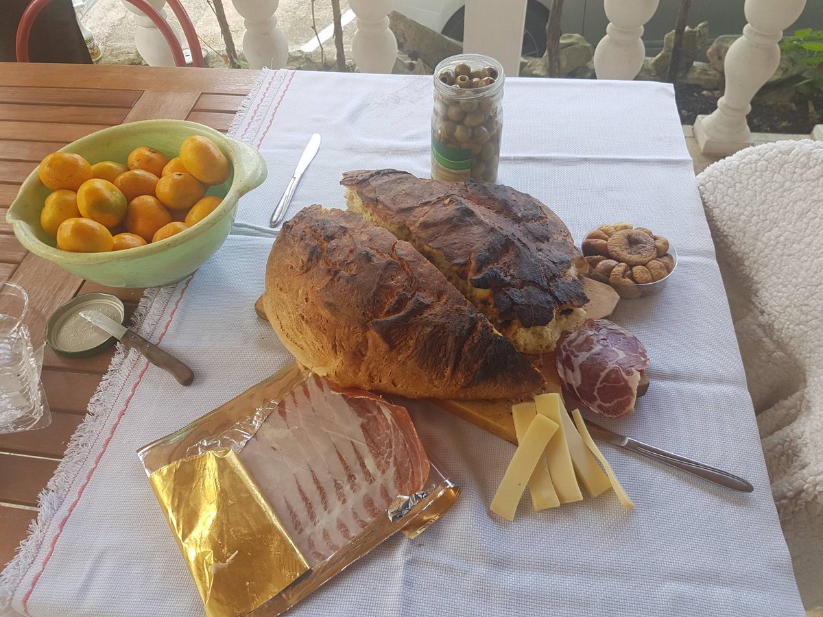 ApartmaniMarko's tweet photo. Homemade bread under hot coals, proscutio, olives, cheese and tengerines. Lunch of champions! https://t.co/wjkZaTrplK