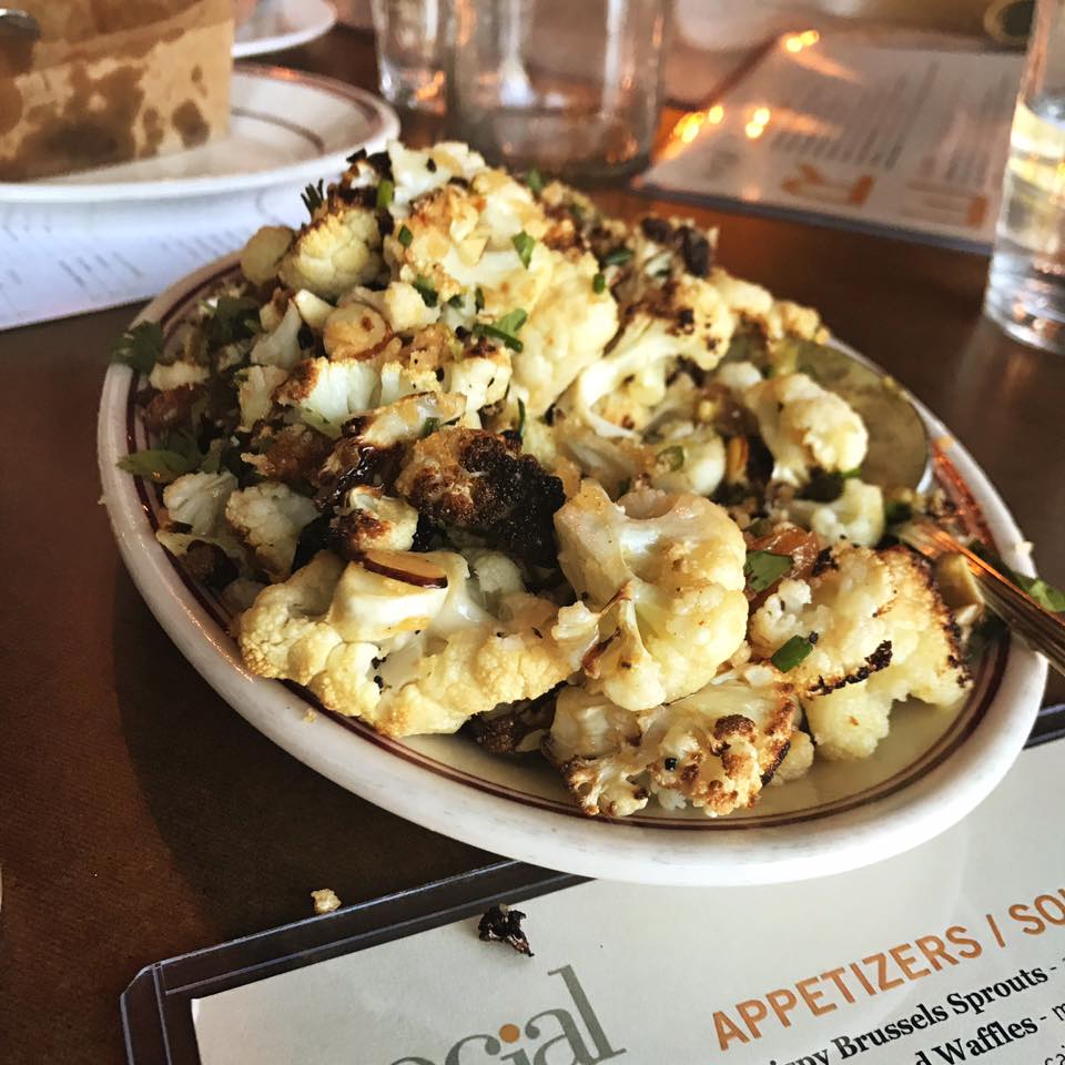 To share or not to share: Roasted Cauliflower tossed in almond butter + spicy raisins.