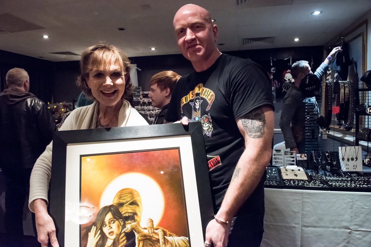 GrantArtist's tweet photo. Here I am with the lovely Madeline Smith and my painting for @WrenchProduct Bizarre Dimensions 3 cover :) https://t.co/1CBMjtakc1