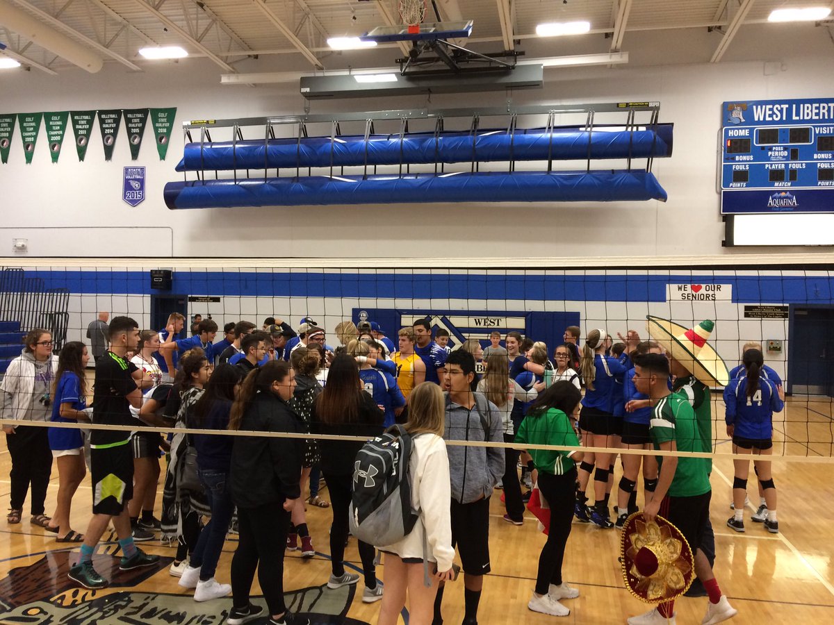 WestLibAthletic's tweet photo. The WL student section joins Comet VB on the court after tonight's round 1 win over Solon.  💙❤️@thelibstudents https://t.co/eDuqzM8Nw2