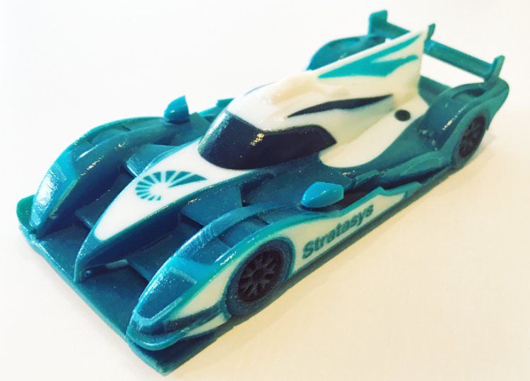 IncusPR's tweet photo. Miguel loves his @Stratasys #3DPrinted @StrakkaRacing car that he received at the World Endurance Championships #IPD17 #PrintUX @IntPrintDay https://t.co/UeNAS9lelk