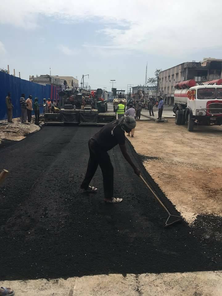 AbdulBillowAli's tweet photo. "Down but not out", engineers repair a section of the road destroyed in Saturday's deadly truck bomb in KM5 #Mogadishu. #Resilience #Somalia https://t.co/OVbxQBEoO5