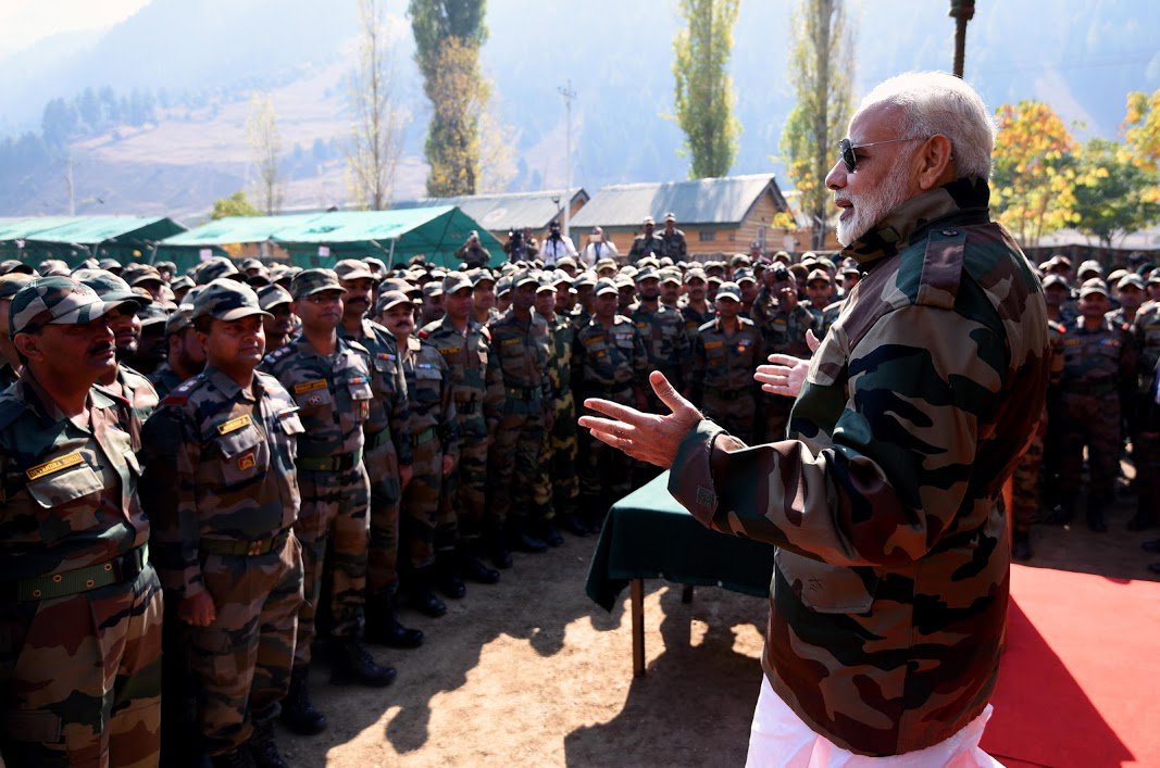 PMOIndia's tweet photo. PM @narendramodi celebrated Diwali with the jawans of Indian Army and BSF in the Gurez Valley, Jammu and Kashmir. This is the fourth successive Diwali that the Prime Minister has celebrated with jawans on the border. https://t.co/lXBcemJgWE