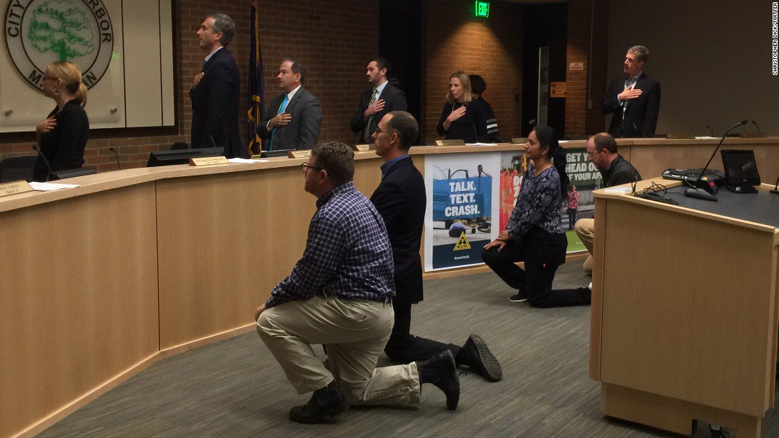 CNN's tweet photo. Four Ann Arbor City Council members take a knee during a council meeting to protest inequality https://t.co/SQLDmXAvUq https://t.co/RvQCODo3Cs