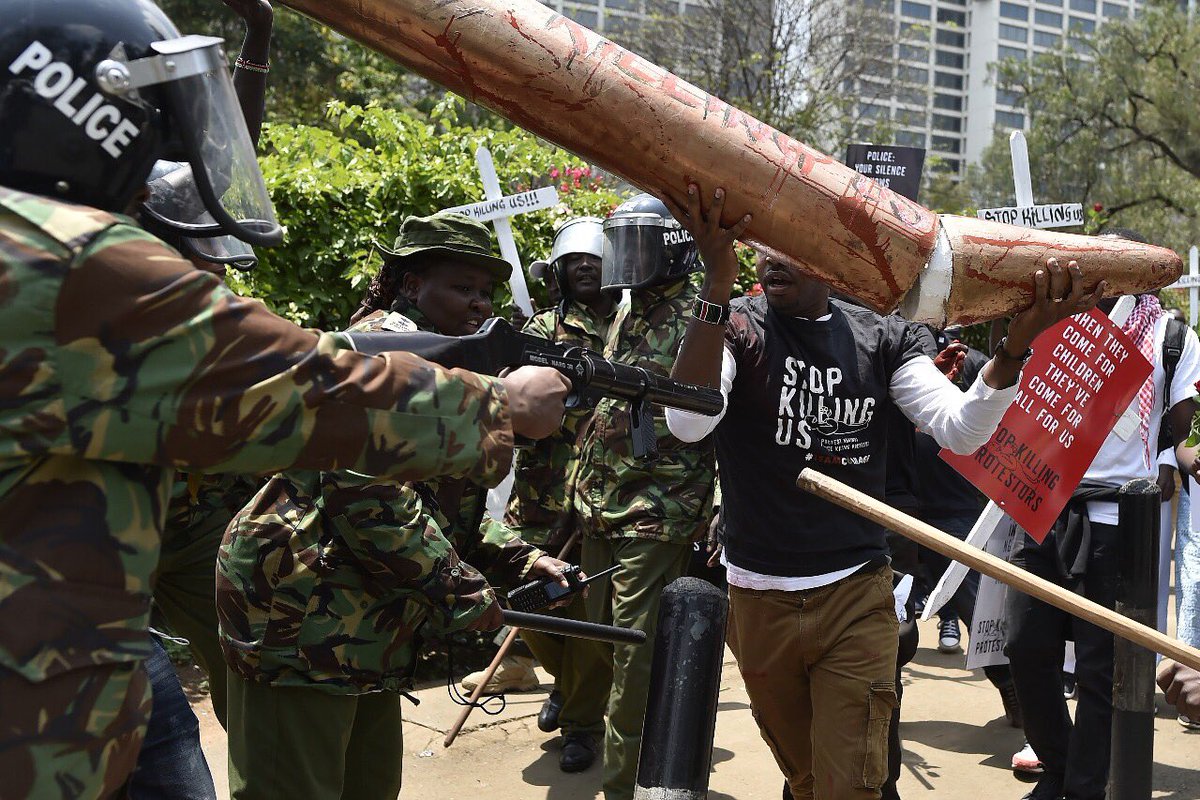 bonifacemwangi's tweet photo. I was a carrying a giant,dummy bullet written #StopKillingUs. The police officer pushed me and then fired to my chest, point blank! https://t.co/DarEAyJ19s