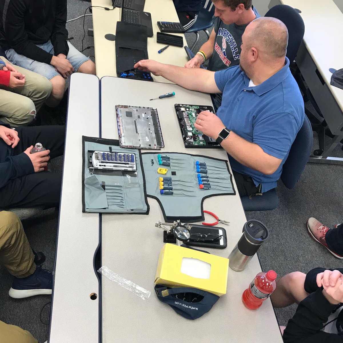 PitTechMHS's tweet photo. Mr. Ruhlen, IT Department @ MEVSD teaching “Pit Tech” how to repair Chromebooks. #PTBM #ThisIsSTC https://t.co/AHa1XhKuo3