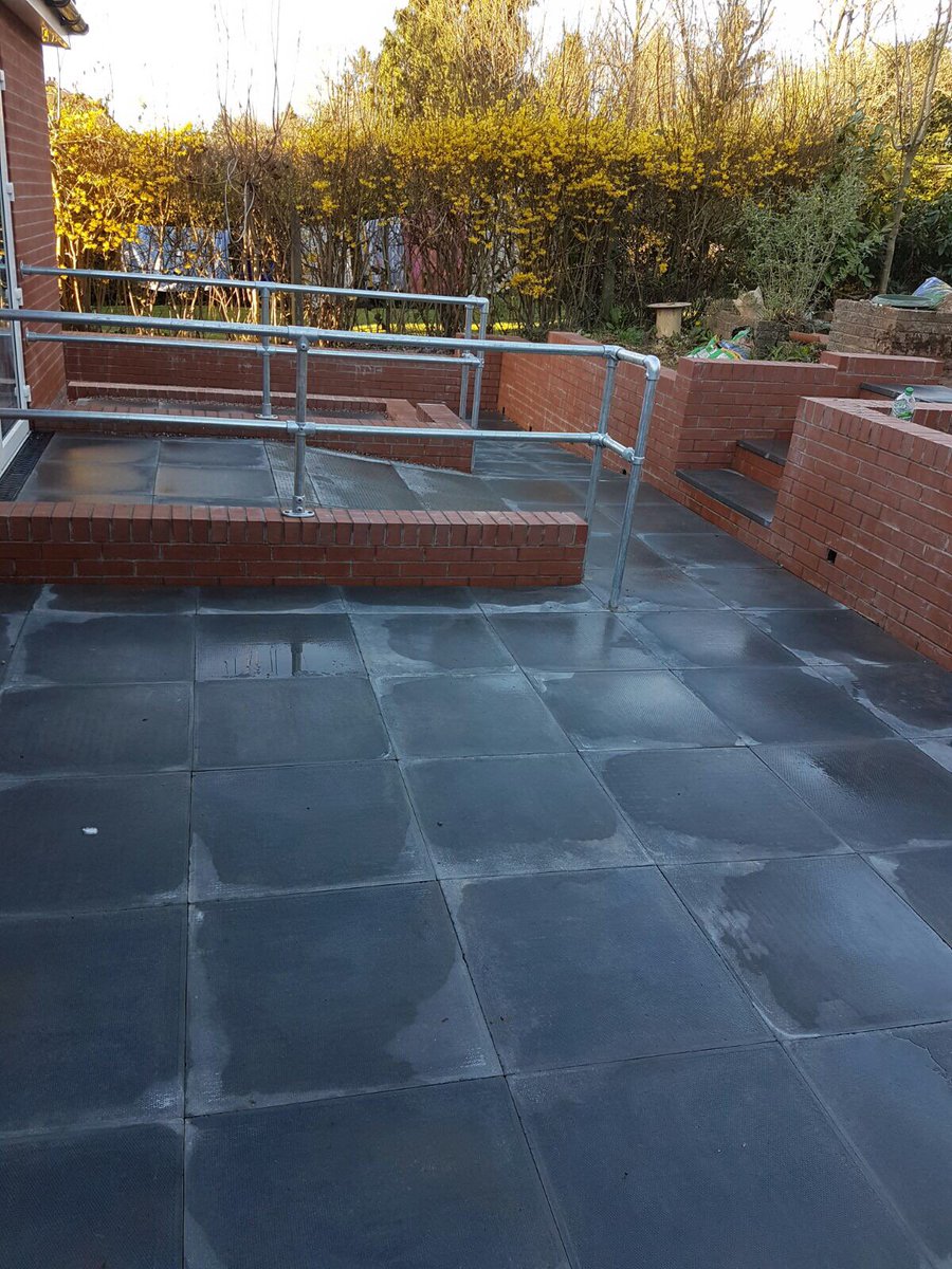 Rear patio area with ramp to extended bedroom (built by others) with key clamp for additional aid.
