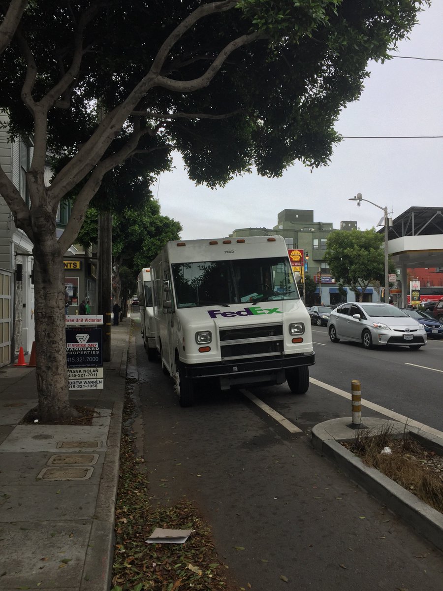 hunterrible's tweet photo. @FedExHelp @sfmta_muni @SFdirtyparking @LondonBreed two trucks blocking “protected” bike lane on Oak. This is every day! https://t.co/HonToNSHUB