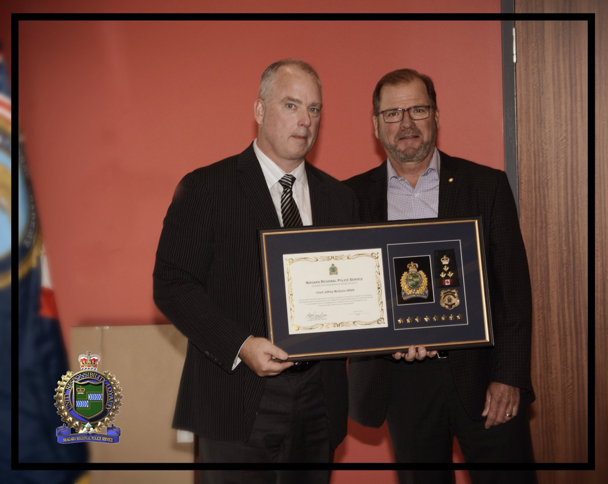 NiagRegPolice's tweet photo. Chief @BryanMacCulloch presenting Retired Chief @ChiefMcGuire with a shadowbox commemorating his time leading @NiagRegPolice https://t.co/9WfbQHROi9
