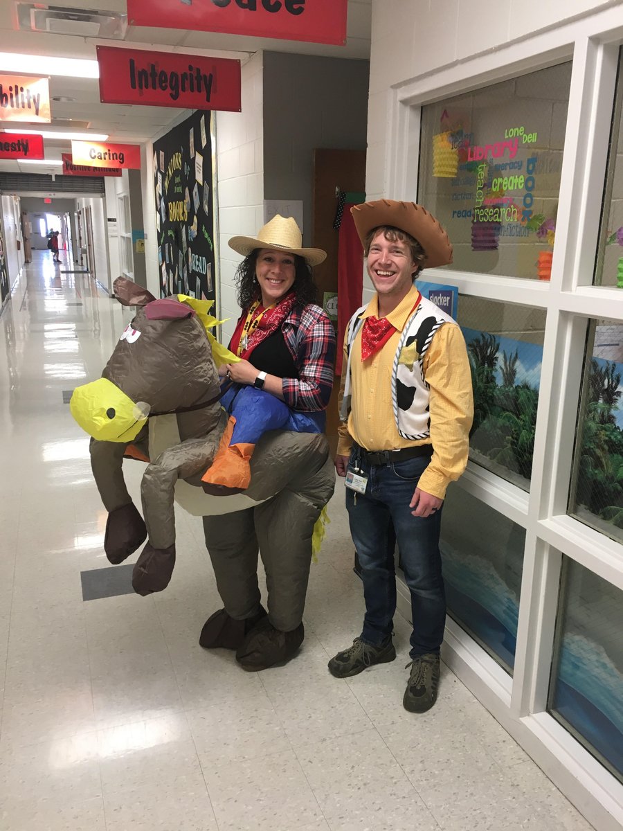 TechieTeacher2's tweet photo. We didn't plan this. Who are we? #cowboys #toystory #LDElibrary #bookfair2017 https://t.co/PYmiNaw3Hm