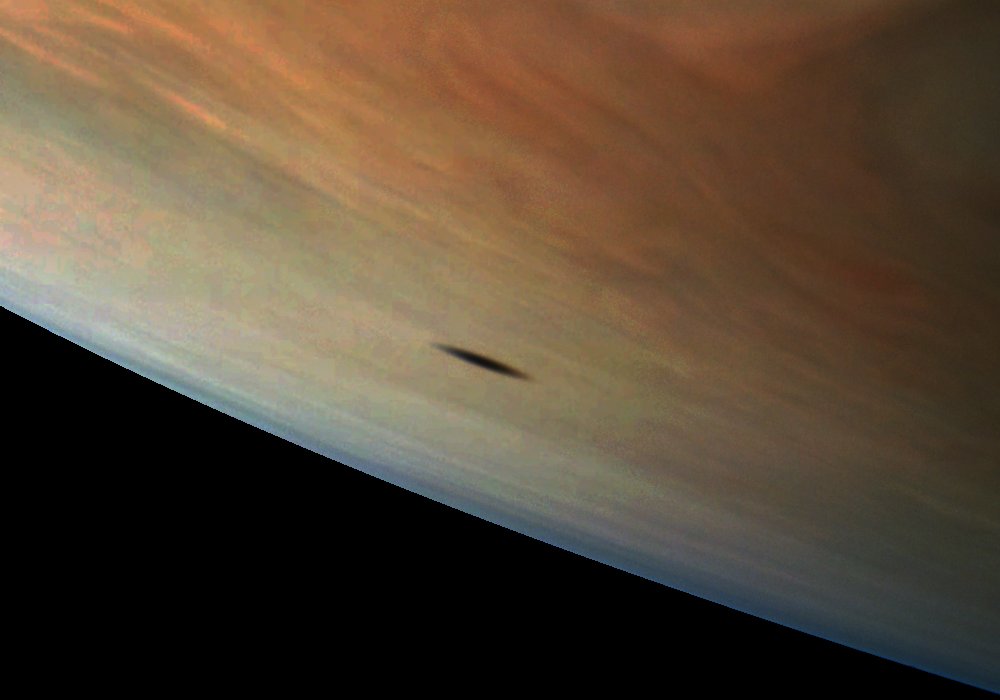 NASAJuno's tweet image. I’m being followed by a moon shadow. #Jupiter’s moon Amalthea casts a shadow on the planet in this #JunoCam image missionjuno.swri.edu/news/jovian-mo…