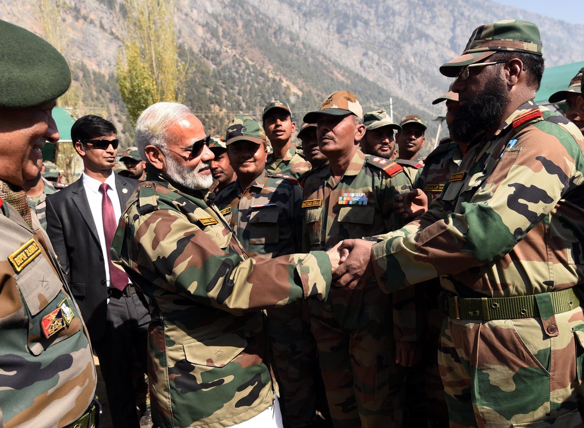 timesofindia's tweet photo. Jawans are family, says PM @narendramodi as he celebrates Diwali with LoC troops https://t.co/gMkGJlqt7J https://t.co/zCRvdKb1Vw