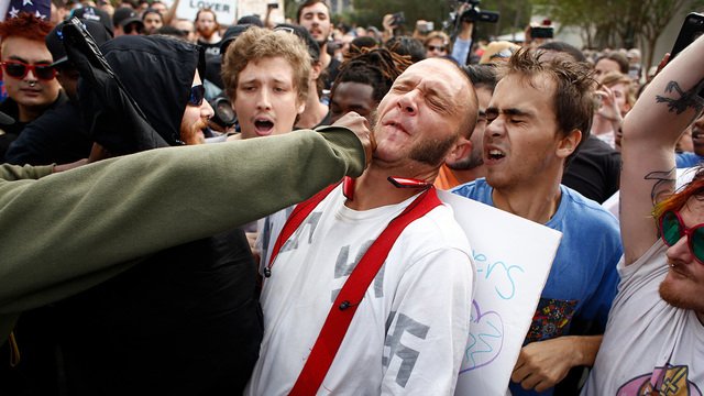 OrlandoAntifa's tweet photo. Honored &amp; humbled to share the streets of #Gainesville with so many comrades today. Don't forget: Nazi-punching is good praxis. #NoNazisAtUF https://t.co/O9vpXvbcso