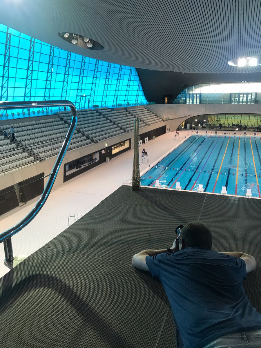 RUFFARCHITECTS's tweet photo. Yes, that IS a @london2012 Olympic torch being shot by @robparrishphoto on the @AquaticsCentre 10m diving board! @Article25 #10x10Stratford https://t.co/A0WZtpCN4X