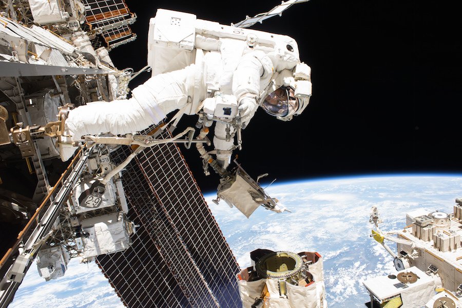 SpaceflightNow's tweet photo. Two astronauts are working outside the International Space Station on a spacewalk today. Watch live: https://t.co/1VcYZuzqw6 https://t.co/dQEUmWdXIs