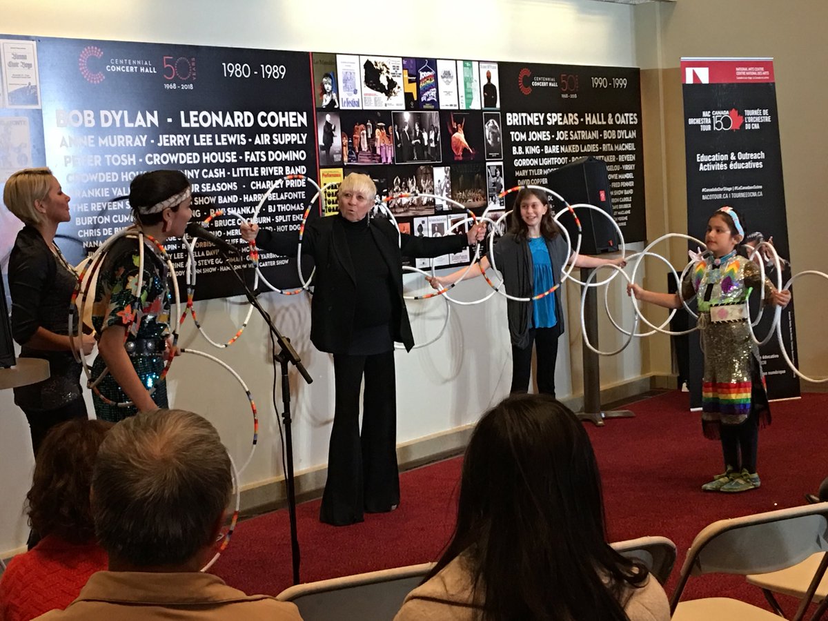 NatashaHarwood4's tweet photo. Audience members participate in the hoop dancing demo with @shanleymary and Rylee Sandberg at Centennial Hall. #nacotour #winnipegtalent https://t.co/iCSdvTUrRY
