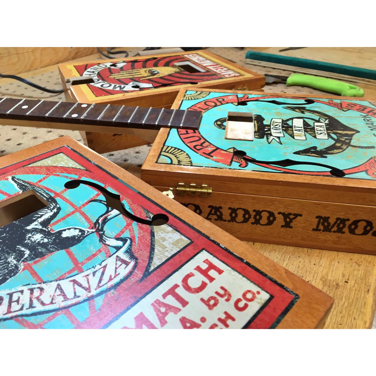 DaddyMojoGuitar's tweet photo. After a year of drafting we are finally assembling our latest Cigar Box Guitar series for it's launch next week! #SneakPeek #DaddyMojo 🎸✨ https://t.co/PsvjmoAWeE