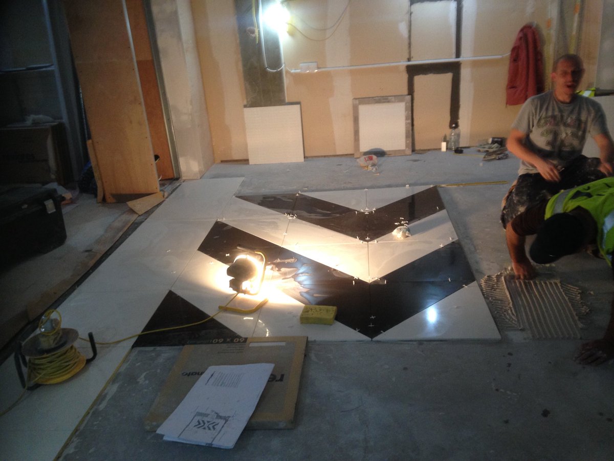 Tiling team making a start on bespoke floor @ Kate Spade, bluewater.