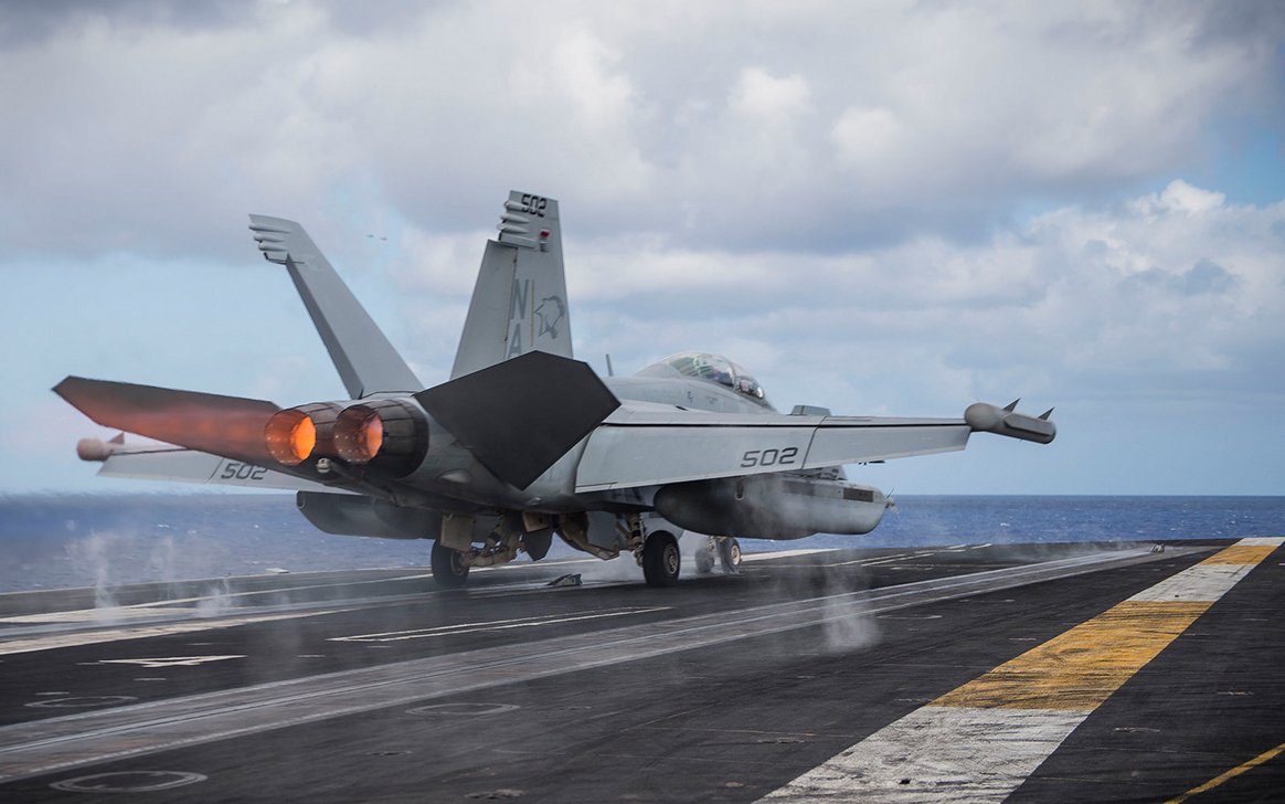 DeptofWar's tweet photo. An EA-18G Growler assigned to the "Cougars" of Electronic Attack Squadron (VAQ) 139 takes off from #USSTheodore Roosevelt. #PacificOcean https://t.co/Cb3sbG08mC