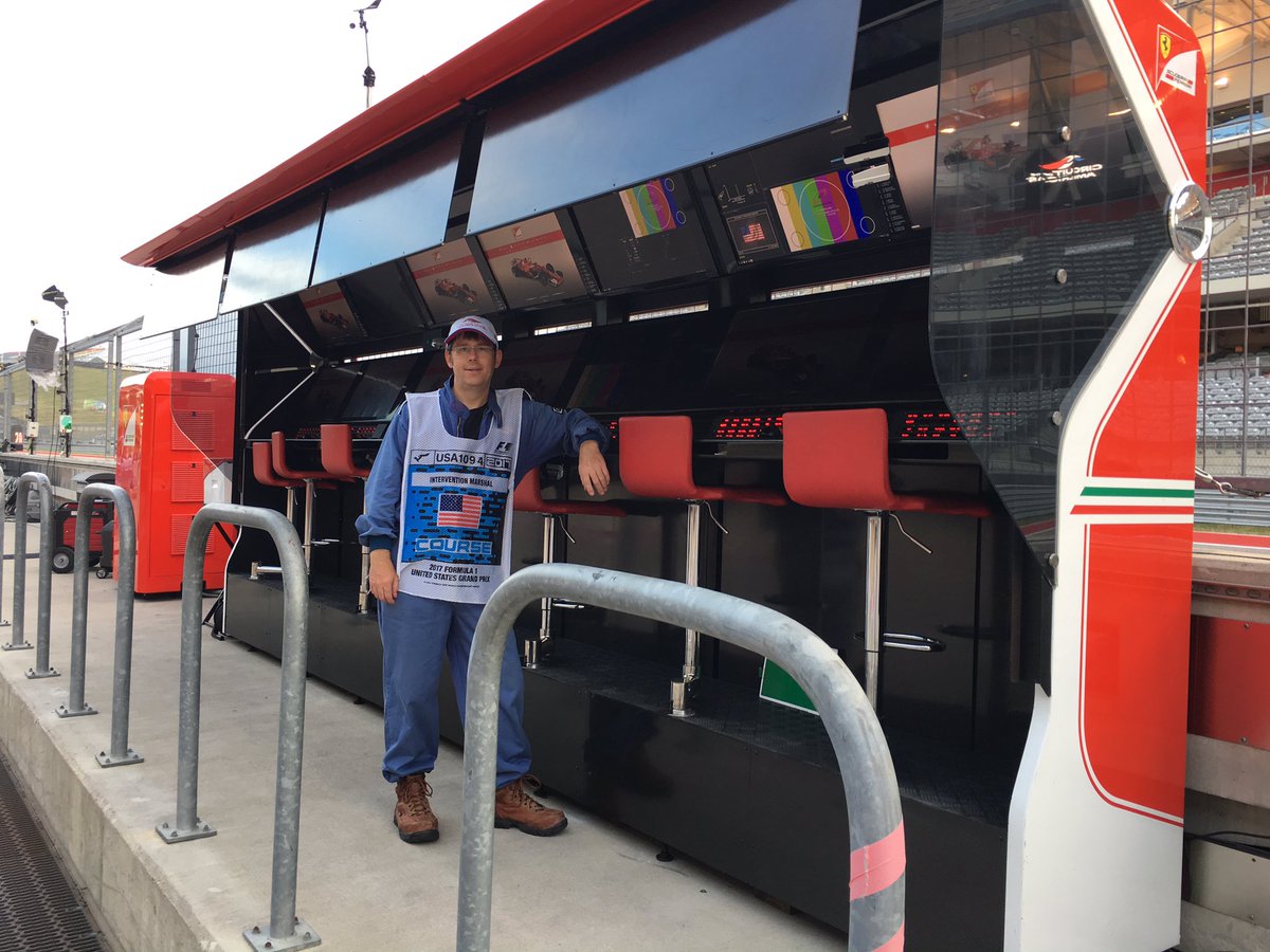 PFZ28's tweet photo. The marshal pit walk was fun! Got a picture of me with @LewisHamilton's car in the garage, and with #Ferrari's control center. https://t.co/NKwTj3uZOW