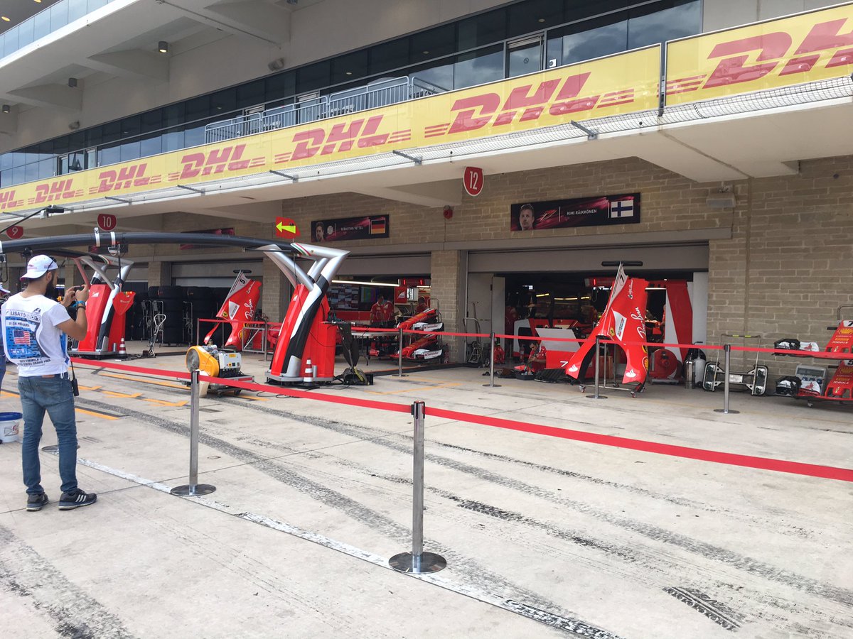 PFZ28's tweet photo. The marshal pit walk was fun! Got a picture of me with @LewisHamilton's car in the garage, and with #Ferrari's control center. https://t.co/NKwTj3uZOW