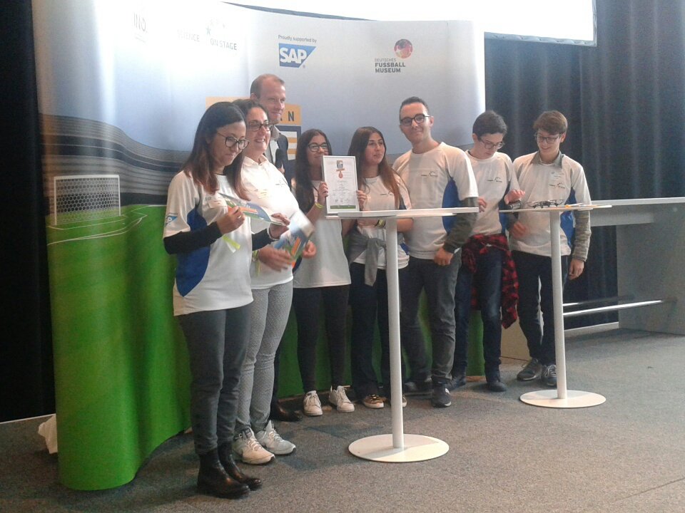 ScienceonStage's tweet photo. Dr. Klaus Behring from @fussballmuseum reads out 3rd place: Team Italy!! #EuropeanSTEMLeague @sap4good https://t.co/4s8vMrTi0o