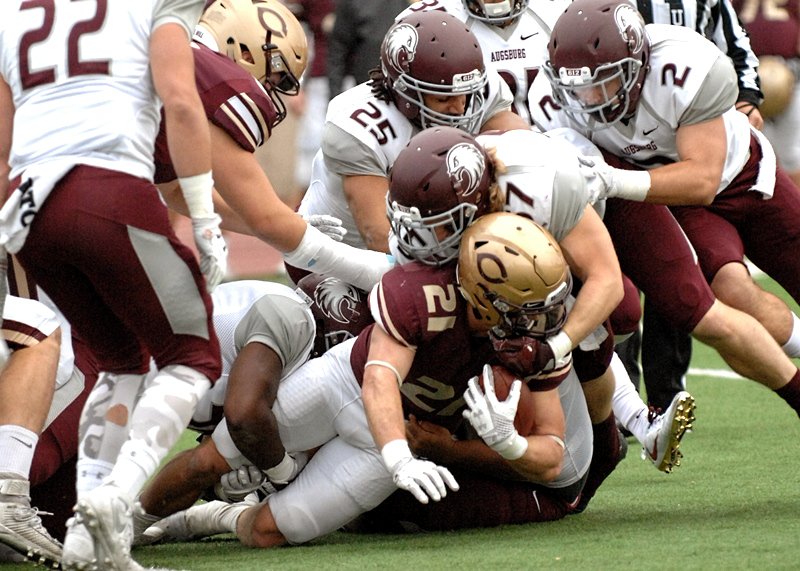 CobberSID's tweet photo. PIC OF THE NIGHT! How many defensive players does it take to tackle @Cobber_Football FB Chad Johnson? We count at least 5⃣! #GroundCorn https://t.co/lLA9baCbsS