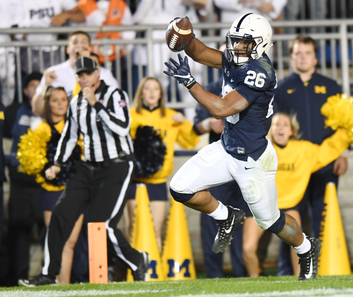 phoebe_sheehan's tweet photo. Penn State running back @saquonb21 fumbles the ball only for a moment before regaining control and scoring a touchdown #PSUvsMichigan https://t.co/jOj7BU2Dwp