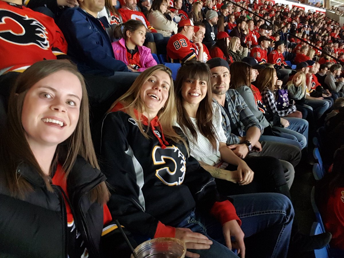 panko202's tweet photo. We suck at selfies. Ala's first flames game!! #flamescaption. Section 223 row 16 https://t.co/VcmzT8VbWa