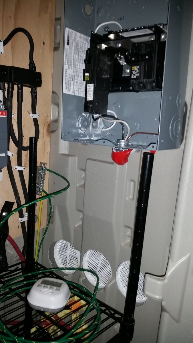 aatheus's tweet photo. 100A panel and outlets installed. Silicone and foam added! Shelf is strapped. Need to wire in inverter still. #PowerShed https://t.co/vlv8kj2l92