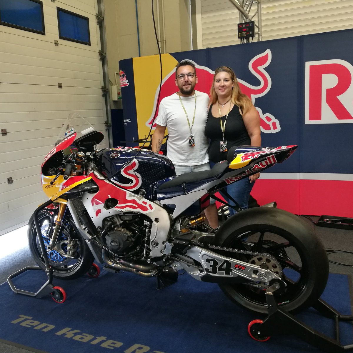 #MyHondaAtJerez winners Ivan and Sonia enjoying the garage tour as VIP guests of the team #RedBull #Honda