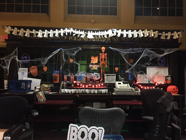 circulation desk decorated for Halloween