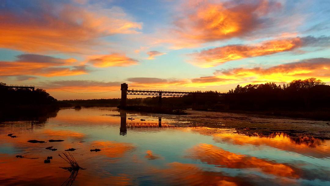 Sunrise
Over Crocodile Bridge 
Tinged by Brado Britz