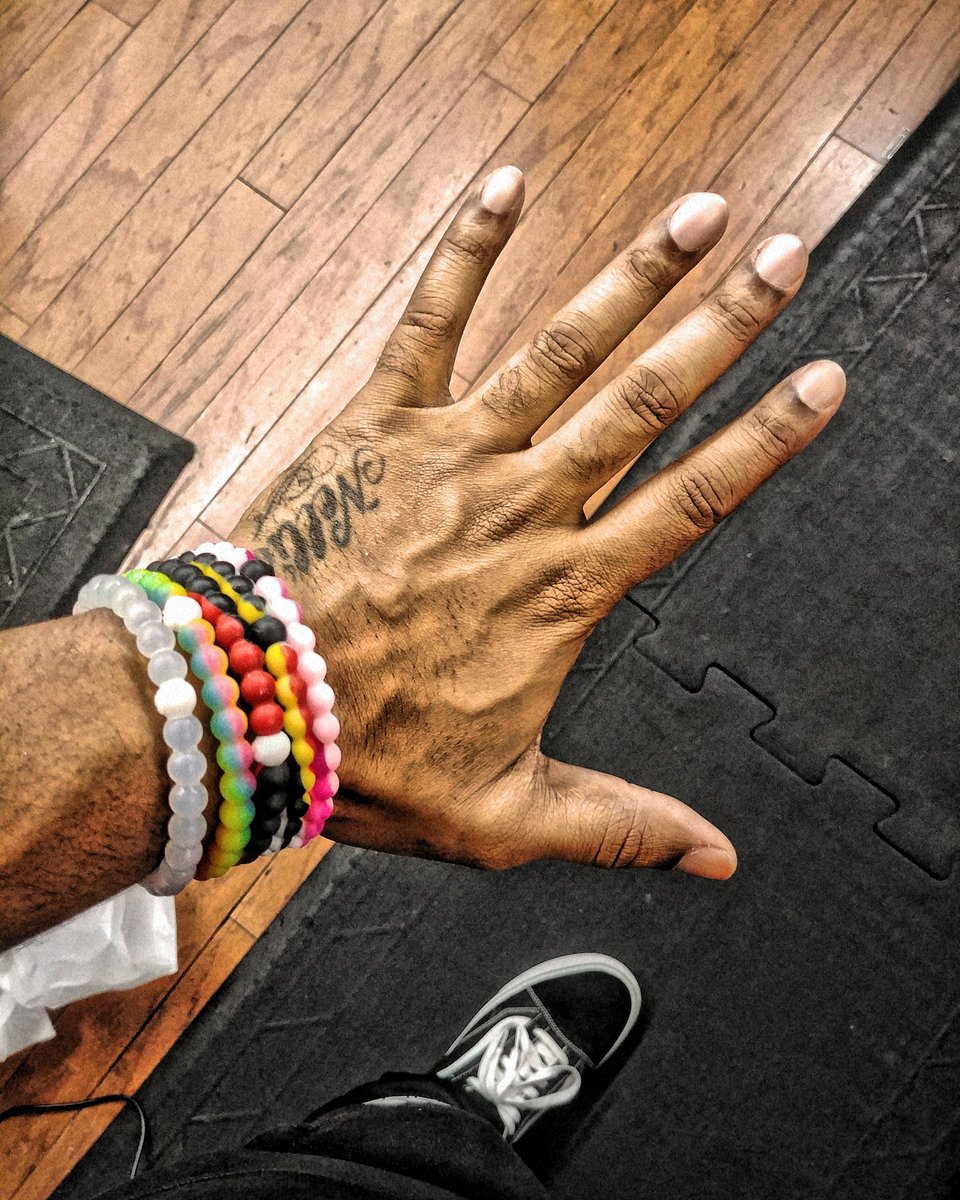 TMosstm's tweet photo. Getting my @CameronNewton on last night rocking these @livelokai bracelets... #lokai #CamNewton #tmoss https://t.co/SyPEZhFLqu