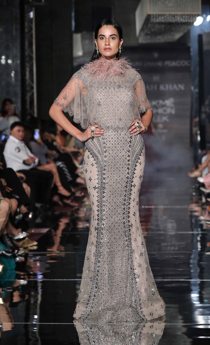 LakmeFashionWk's tweet photo. #LFWTrends : @falgunishanepea paired floor-length capes with ballroom gowns and bodysuits. https://t.co/qNaXXnqEfz