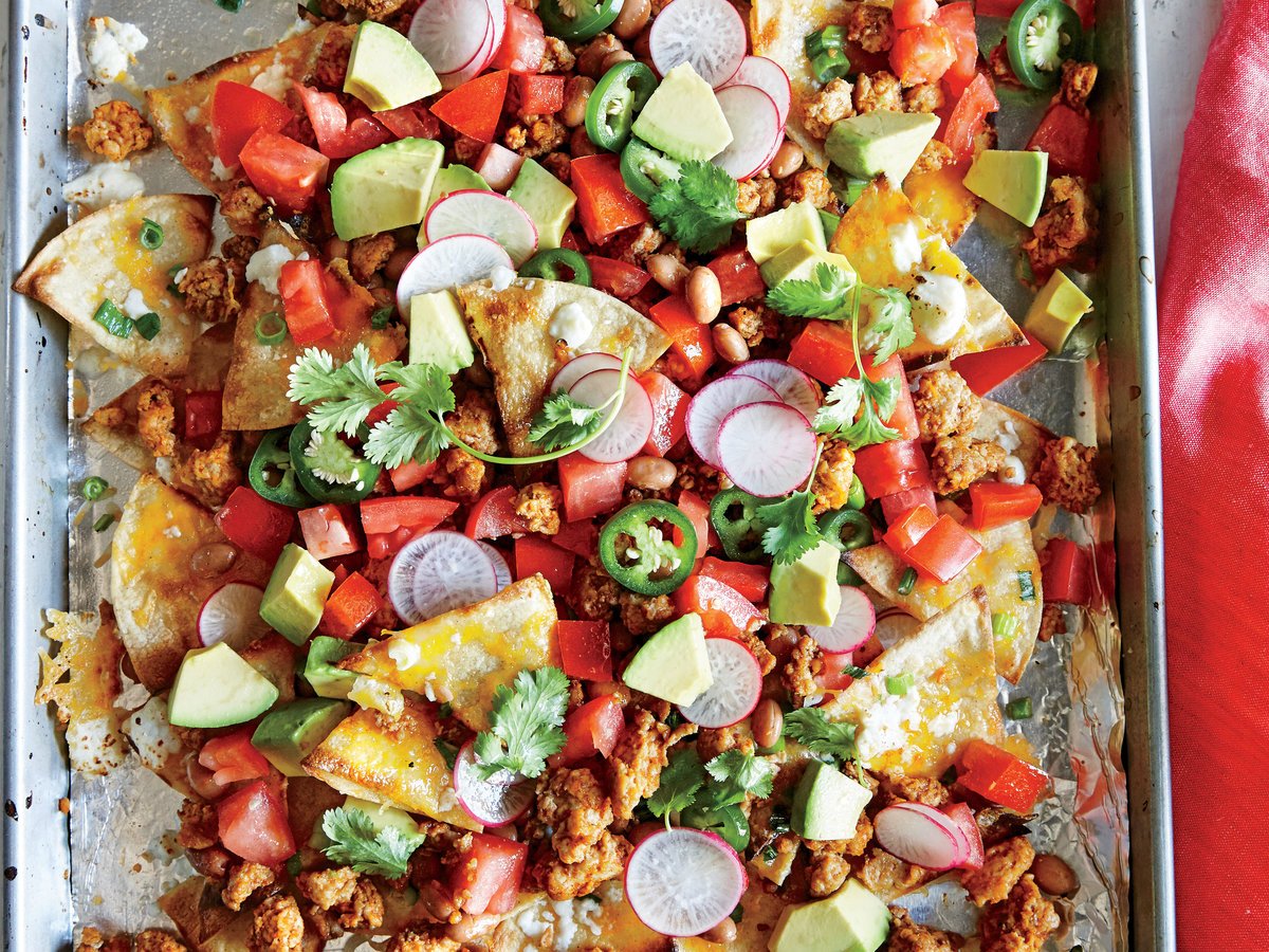 foodandwine's tweet photo. 8 things you didn't know about nachos, for #NationalNachosDay:  https://t.co/TWWoWI0Ntl https://t.co/jJQFoKtCOQ