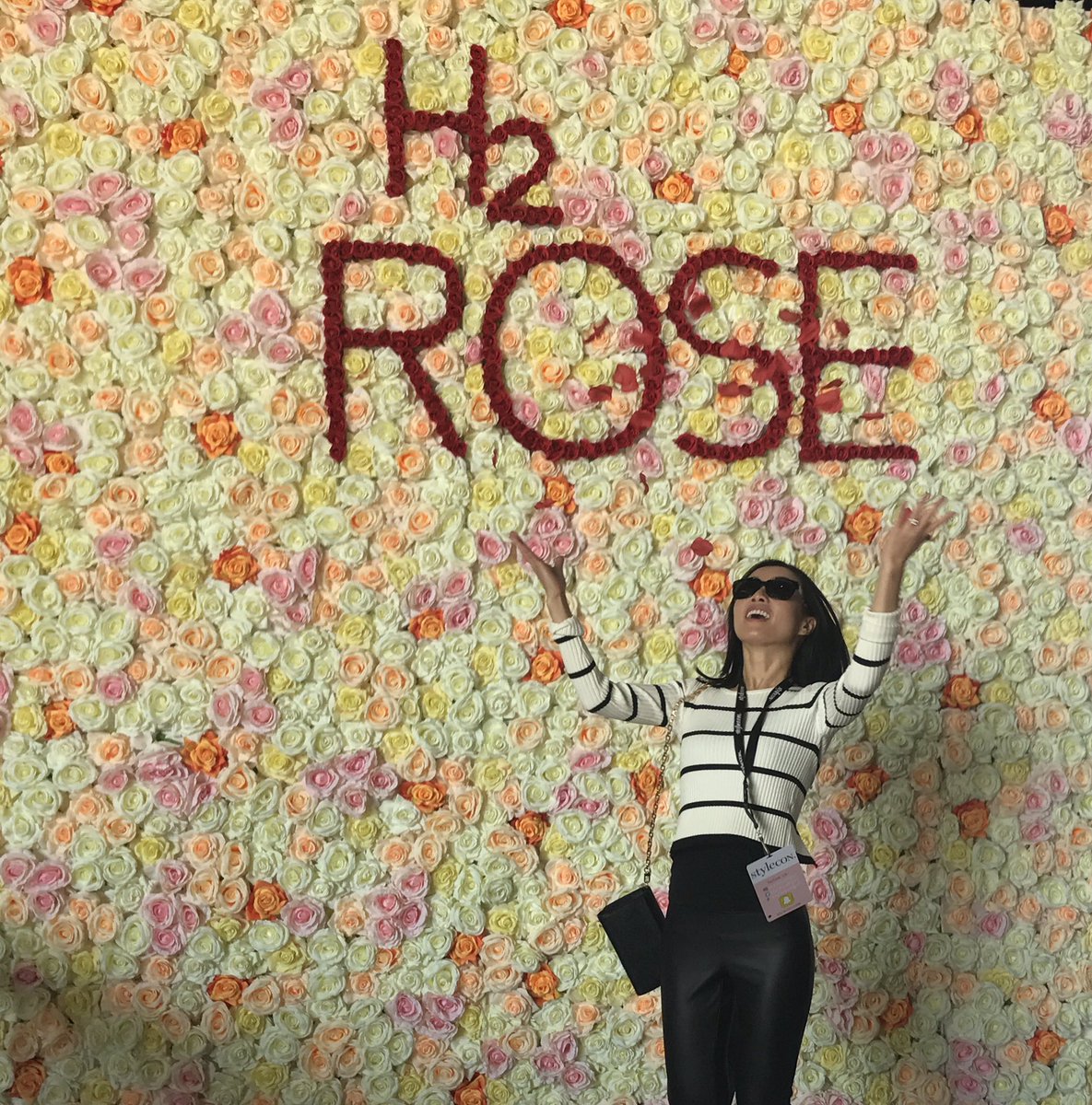 One of our #StyleconOC babes is making it rain at our <a href="/DrinkH2rOse/">H2rOse Beverage</a> booth! #H2Rose