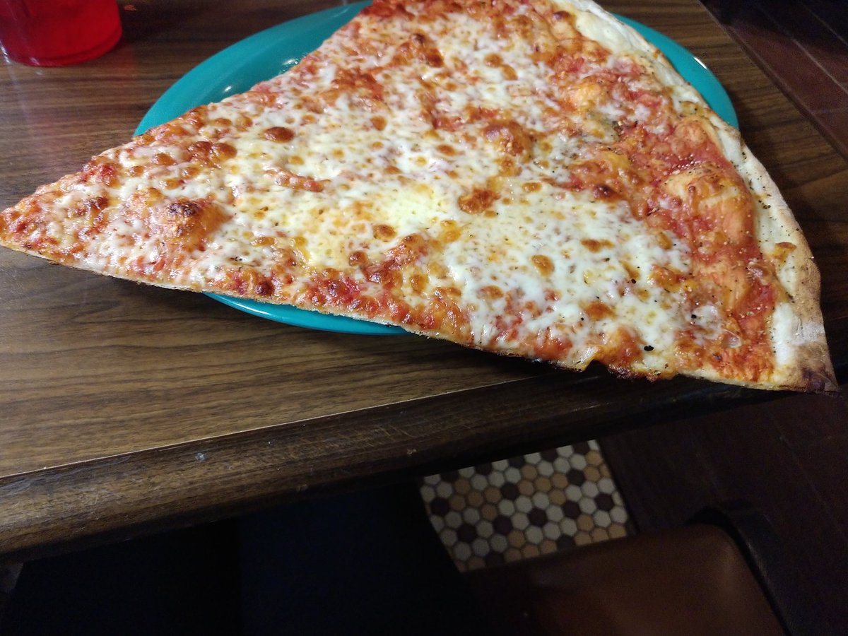 thrasher_queen1's tweet photo. Went to Joey Nova's with my boyfriend @icantkickflip this is how huge a slice is #NewYorkstylepizza https://t.co/eyv8eG3dZ0