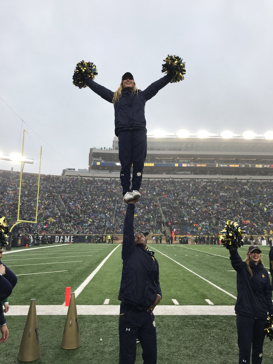 NDCheerTeam's tweet photo. A rainy @gamedayND couldnโt stop #ndcheer from stunting or @NDFootball from #winning yet again!! https://t.co/UbSwaYJz27