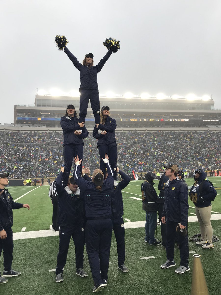 NDCheerTeam's tweet photo. A rainy @gamedayND couldnโt stop #ndcheer from stunting or @NDFootball from #winning yet again!! https://t.co/UbSwaYJz27