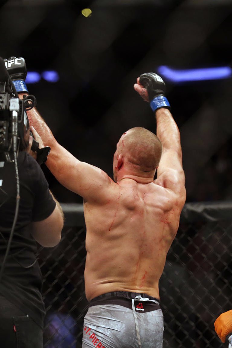 TheGarden's tweet photo. A legend completes the long journey back in becoming the new @UFC middleweight champion at The Mecca.  #GSP #UFC217 https://t.co/XyTRmAicwu