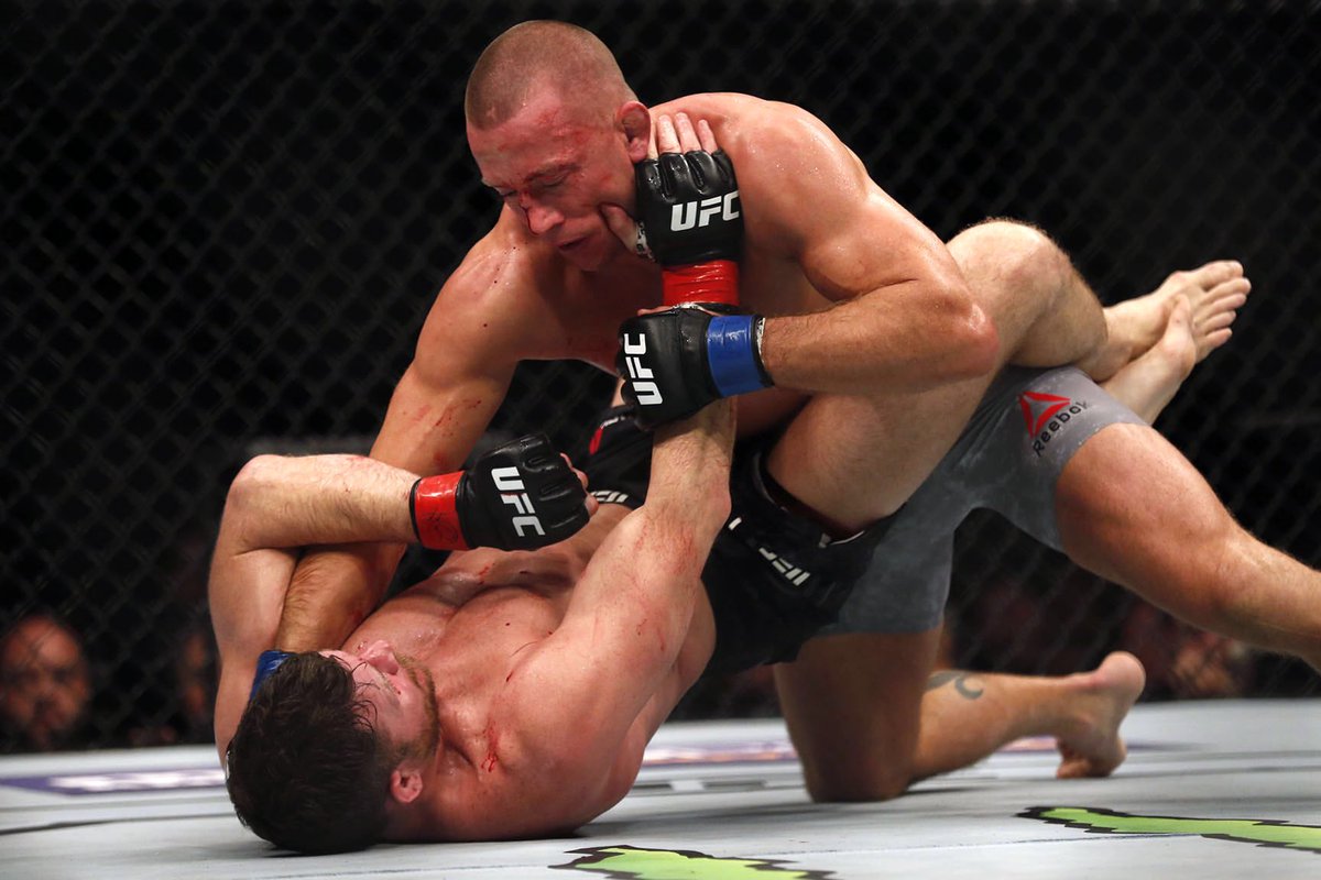 TheGarden's tweet photo. A legend completes the long journey back in becoming the new @UFC middleweight champion at The Mecca.  #GSP #UFC217 https://t.co/XyTRmAicwu
