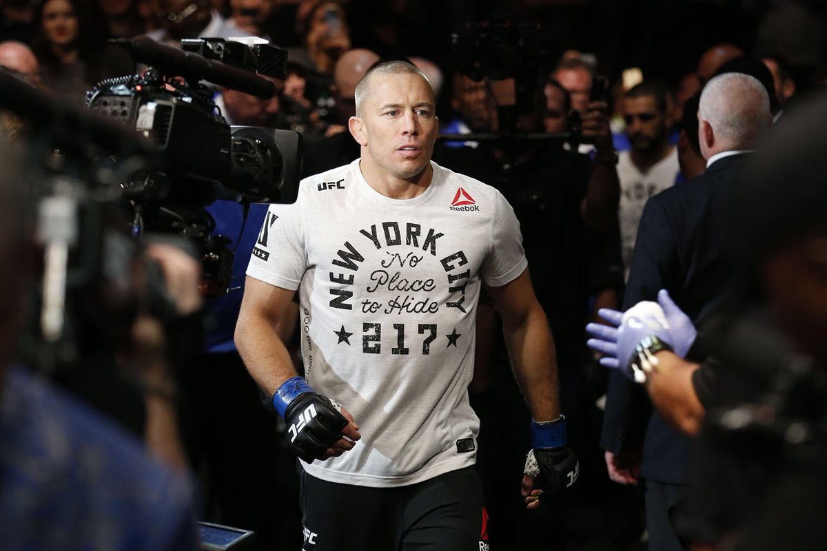 TheGarden's tweet photo. A legend completes the long journey back in becoming the new @UFC middleweight champion at The Mecca.  #GSP #UFC217 https://t.co/XyTRmAicwu