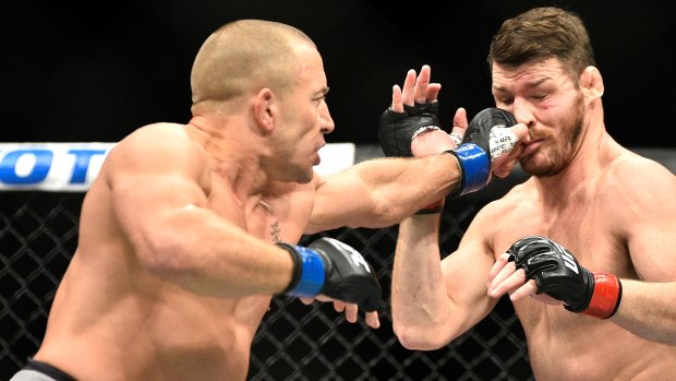 TSN_Sports's tweet photo. St-Pierre defeats Bisping in middleweight title bout. MORE: https://t.co/MU5OwjQ42e https://t.co/TBFXX4iZyr