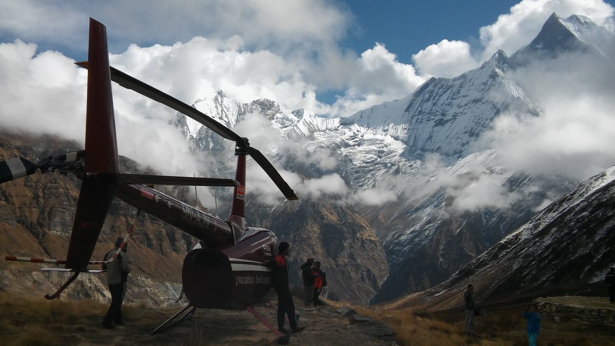 One of several tourist choppers to visit ABC per day with Machhapuchhare in the background #potentialliftdown