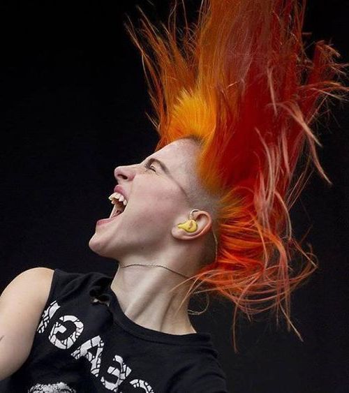 hayley sitting in the back seat of the car with the front window open