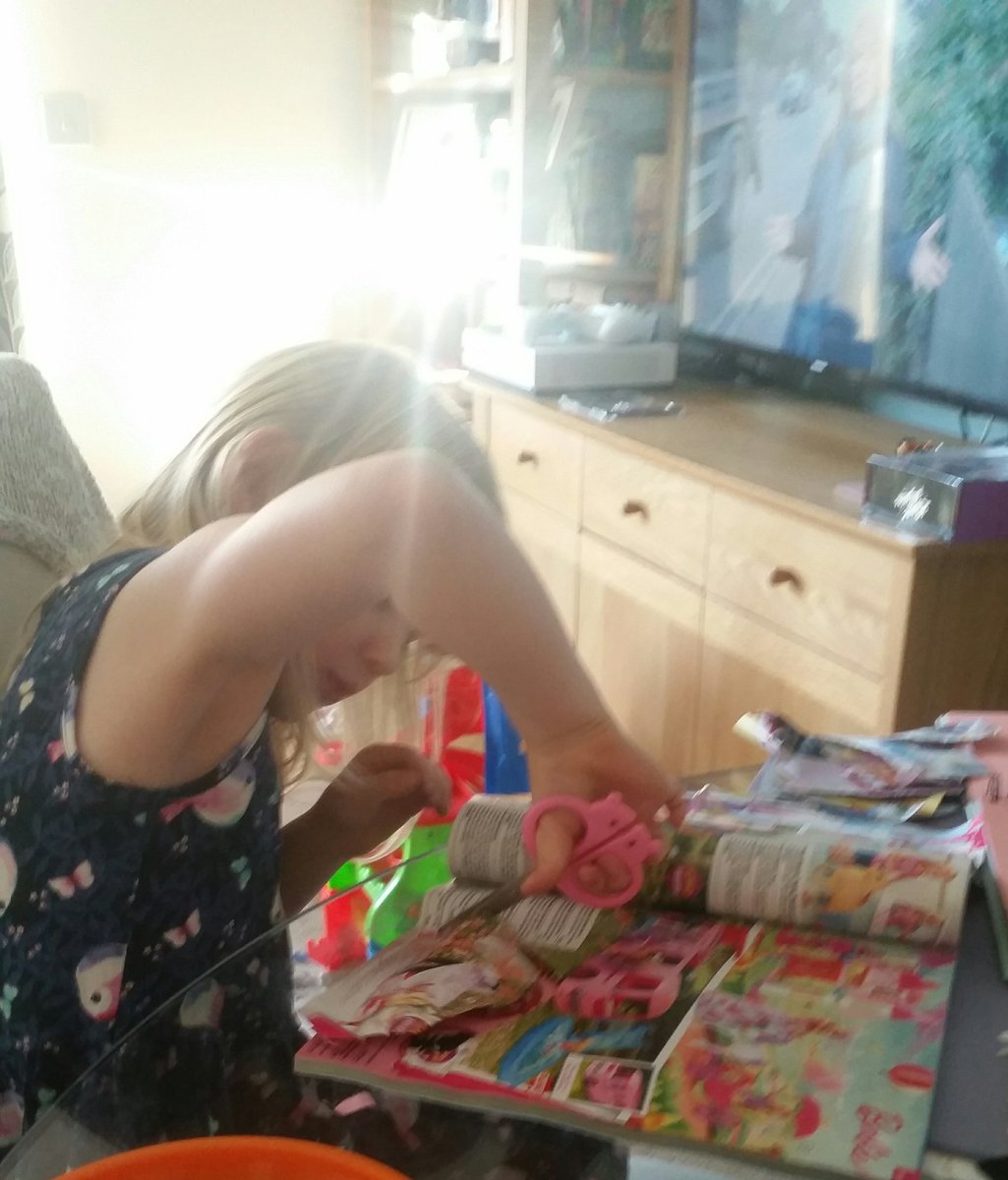 emilytealady's tweet photo. My daughter cutting out every item in the @SmythsToysUK catalogue for her christmas list https://t.co/FBik7HiV3c